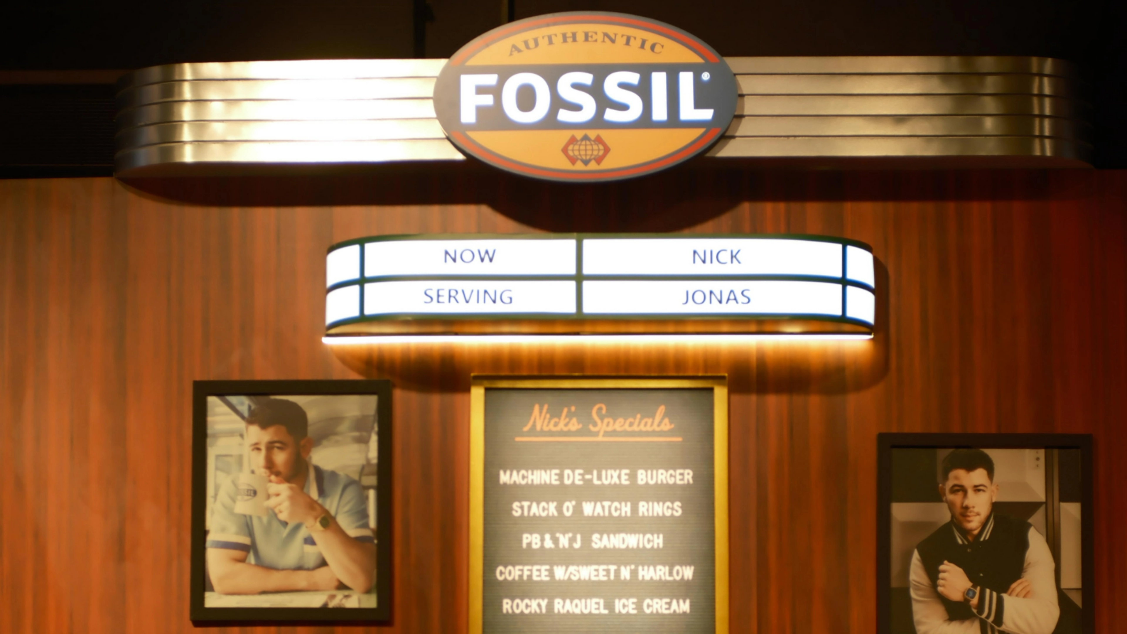 Fossil Diner activation - Classic milkshake bar with stainless steel fixtures, vintage signage, and authentic 1950s soda fountain details
