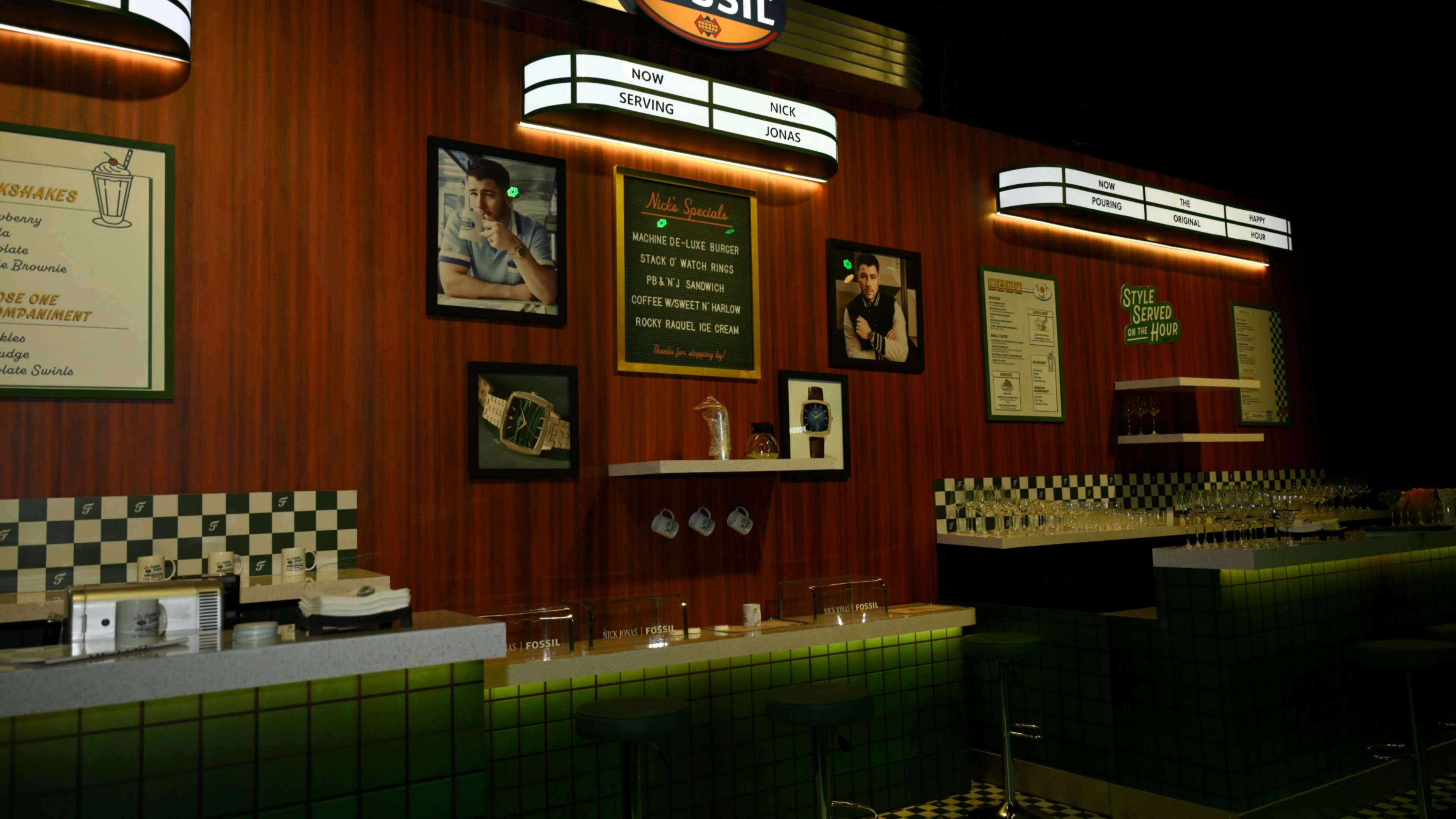 Fossil Diner activation - Counter service area with vintage cooking equipment, chrome details, and authentic menu boards from the 1950s era