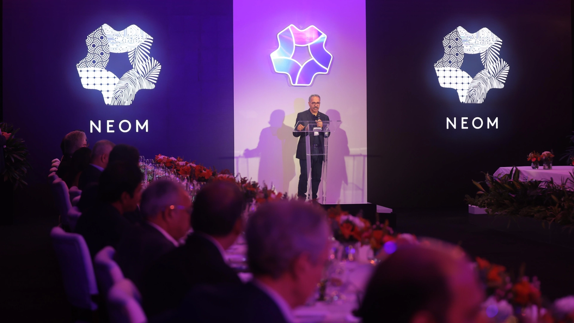 NEOM Brand Activation - Attendees networking in the conference lounge area with modern furnishings