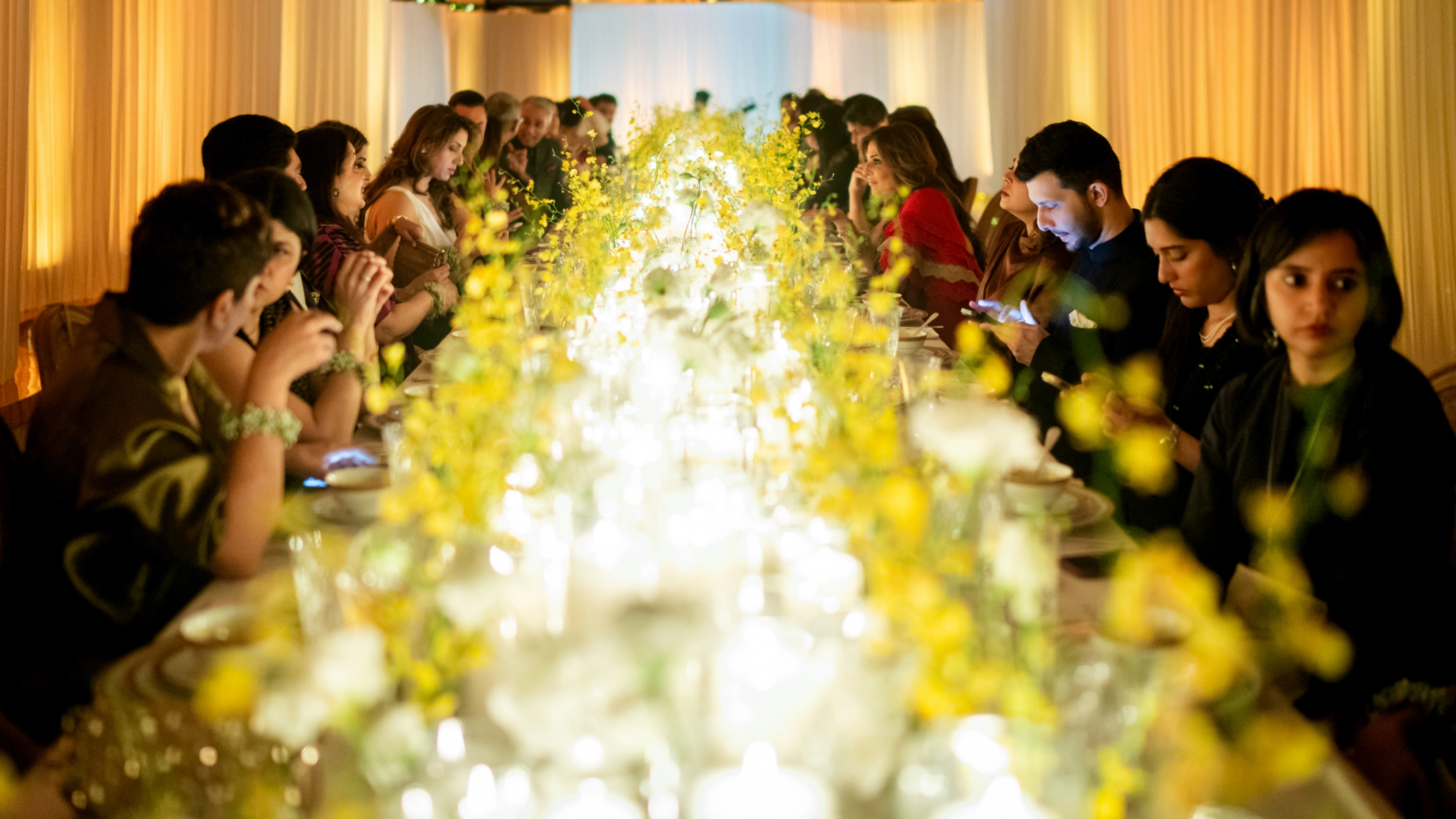 Valentino Diwali Dinner luxury fashion event - tablescape with bespoke ivory tableware, earthen textures, and premium floral arrangements
